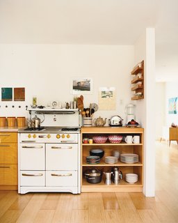"A lot of the things in here are found objects," Siegal says of her home’s contents. The vintage stove, with its funky yellow Bakelite knobs, was inherited from the previous owner.