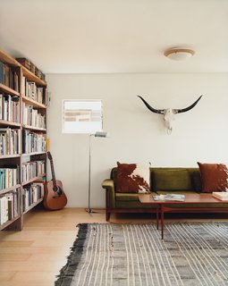 Siegal built bookshelves from scrap wood, bartered for her Danish modern furniture, and haggled for a living-room rug in Morocco.