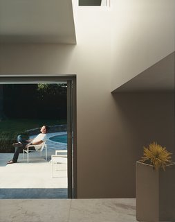 Daylight, admitted by way of clerestory windows, brightens the dark zones between the kitchen and the den.