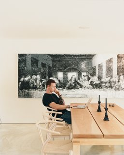 LeBlanc sits at the western maple dining room table, designed by the architect.