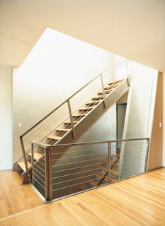 What was once a closed-in staircase has been opened up, allowing light to pour in.