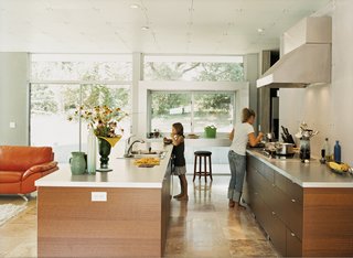 Muriel samples some of Haley’s culinary offerings in the new kitchen. The deep window doubles as an eating area and a place to serve guests.