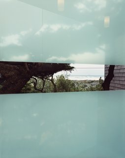 This Surfer's Beach House is More Than It Seems - Photo 8 of 13 - The frosted glass of the bridge offers a transparent stripe and a view of the ocean.