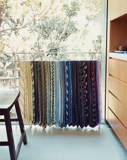 This Surfer's Beach House is More Than It Seems - Photo 9 of 13 - The collection of neck-ties Lloyd-Butler and Zelen have amassed is on permanent display draped over an upstairs railing.
