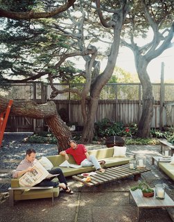 This Surfer's Beach House is More Than It Seems - Photo 12 of 13 - Zelen (left) and Lloyd-Butler take advantage of their shady outdoor space.