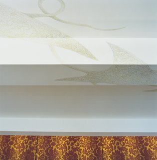 Delicate detail punctuates the ceiling, which was once covered in Soviet army signatures.