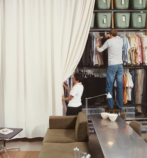 Modern Mixed Use in San Diego - Photo 11 of 11 - Local sailboat shops wanted thousands to make the 13-by-13-foot curtain that hides the Wall of Storage. "We we called my parents in Bangkok, gave them the dimensions, and they got it made for 150 bucks." says Im.