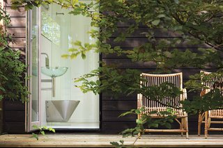 We Summer in the Hamptons - Photo 3 of 6 - In keeping with the house's spirit, its master bath calls for a sense of adventure.