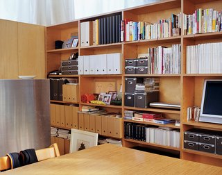 The architects designed a tall unit of closets and open storage to minimize clutter but also echo traditional Japanese architecture—an open plan with no floor-to-ceiling inner walls.
