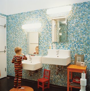In the tiled master bathroom, the boys get their own sink.