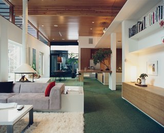 In lieu of a checkerboard effect, Kovel kept his carpet squares all vibrantly verdant. With the bamboo cabinets and countertops the whole space has a pastoral feel. "I wanted it to be like the Bradys’ backyard," he says.