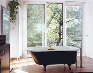Medium’s master bedroom is outfitted with a claw-foot tub.