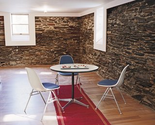 Schenk discovered native flagstone in the basement of Large when they tore away the old wood wall lining, and fell in love with its rough and cool exterior.