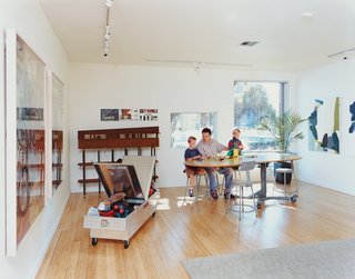 Bo and Sky get a building lesson from dad on a custom table designed by Baird and his studio.