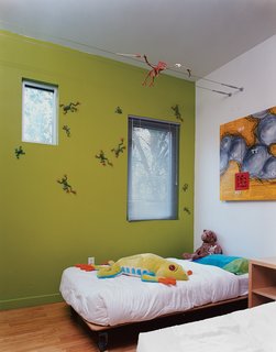 The boys’ bedroom is outfitted with custom beds designed by Baird’s studio.