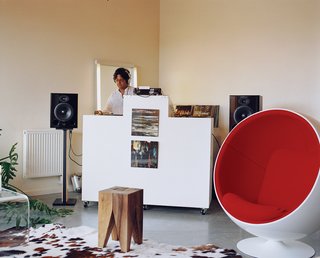 Community Building - Photo 7 of 10 - Attorney by day, DJ by night, Sanjiv Kripalani’s design inspiration for his Belmont loft was the futuristic vision of director Stanley Kubrick. The Ball chair by Eero Aarnio is manufactured by Adelta.