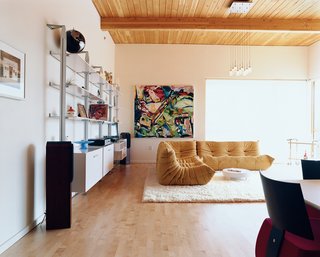 Community Building - Photo 9 of 10 - Rapaport is a confirmed Ligne Roset fanatic—his living room may as well be a showroom for the French manufacturer. The centerpiece is a classic Togo sofa designed by Michel Ducaroy; the wall system was designed by Pagnon and Pelhaitre.