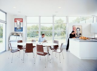 The open kitchen and dining area of Romero and Bradford’s LV Home is flooded with natural light. Dining table and chairs by IKEA. Antique jukebox by Wurlitzer.
