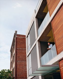 Developer Chris Sally has been known to have conversations with passersby from his "cigar-smoking balcony."