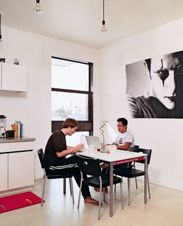 The dining area of the two-bedroom unit, which occupies the top two loors of the structure.