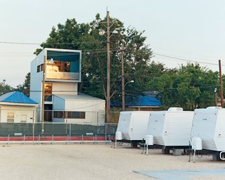 When Bild began work on the Lowerline House, a beautiful green baseball field sat across the street. Within two weeks after Katrina struck, the baseball field was transformed into a FEMA trailer neighborhood housing many displaced Tulane workers. "I think it is really prophetic," Mouton says. "As soon as we put up this steel-clad thing, all these other steel-clad things migrated here too."