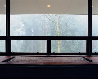 The architect refers to the huge window opposite the bed as their "flat-screen television."
