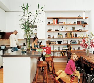 Row House Revival - Photo 5 of 8 - The Ogrodnik/Bardin family enjoy the pleasures of family life in the kitchen.