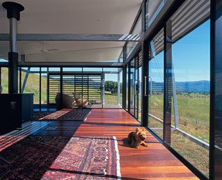 The home’s stretched veranda form is a model of economic and democratic design of extruded and repeated elements. It’s no accident that this generates major cost savings, thermal efficiencies, and is generous in shared amenities for all residents. The terrier, however, is mostly interested in the view from his eye level.