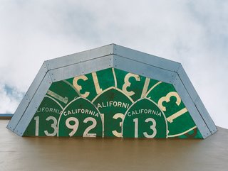 As seen from below, highway signs from California make for a unique exterior detail.