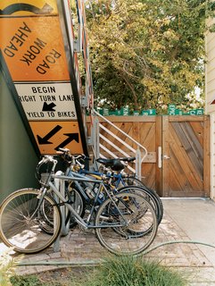 Residents park their bikes under the stairs, which lead to the second-floor units.
