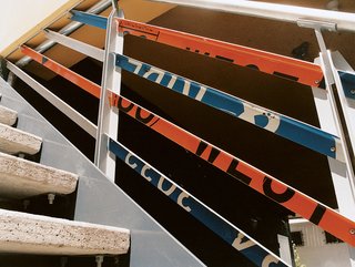 The architects also bent the signs into railings.