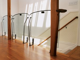 Hatches from Mazdas create a unique railing in one of the condos. Large amounts of natural light spill in from the new skylights.