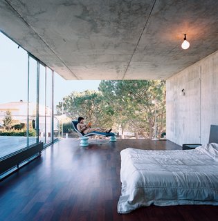 Suburban House of the Future by Cloud9 - Photo 6 of 10 - Giovanna de Uzin Fontecha relaxes in the master bedroom on a Leaf chaise by Claesson-Koivisto-Rune for Living Divani.