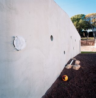 Suburban House of the Future by Cloud9 - Photo 8 of 10 - A CNC-cut formwork was used to create the wavy pattern in the home’s concrete outer walls.