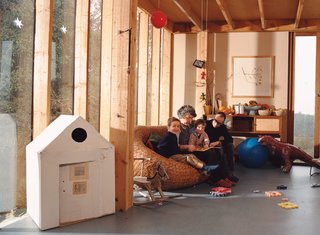 Emerald in the Rough - Photo 1 of 10 - In the living room, the vertical timber columns that support the roof are in plain sight. Stevens wants his children to understand how their house stands up. His building method was partly inspired by Walter Segal, a mid-20th-century German architect who spent most of his life in London.