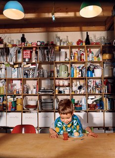 Emerald in the Rough - Photo 6 of 10 - Kitchen storage is made simple with a handmade grid of shelves.