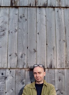 Emerald in the Rough - Photo 10 of 10 - Architect Dominic Stevens in front of his timber-clad house in northwest Ireland.