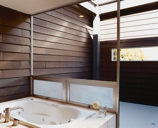 The master bathroom has its own open-air patio that faces the street.