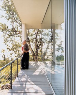 The whole house opens up to its surroundings with floor-to-ceiling windows that are perfect for nature gazing.