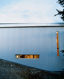 Sattler-Smith explains that "the north side of the house is covered with corrugated galvanized steel and pierced with only a few very small windows; this protects from the 100-mile-per-hour north winds."