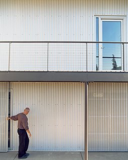 Burke demonstrates the sliding doors that open to the couple’s garage.