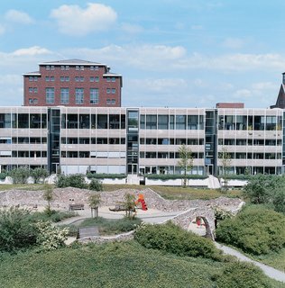 The NF1 apartment building where Carsten Cox lives has an inner garden, in which fanciful Park Guell–inspired structures utilize the rubble of the buildings demolished to make way for it.