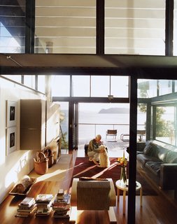 Three Glass-and-Copper Pavilions Conquer the Cliffs - Photo 3 of 10 - The living room structure soars to two stories, with banks of glass louvers at the upper level providing cross ventilation.