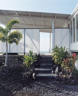 The lava rock used for the steps was cut on a giant saw near Hilo. Craig finished assembling the staircase just in time for Zane’s one-year baby luau.