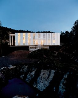 Looking like a jewel box at dusk, Scott Stafne’s Canti-lever House rests easy in the middle of the Washington woods. With miles of hiking trails, lakes, and waterfalls to explore, Stafne’s property provides almost unlimited opportunity for outdoor adventures. The strong and sturdy house acts as a warm respite from the elements when the weather won’t cooperate, which is often—horizontal rain and whipping winds can be the norm.