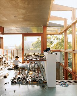 In the new addition to the Hertz/Fong residence, the architect’s son Max tinkers with his extensive array of Legos and War Hammer miniatures in the upstairs office/playroom.