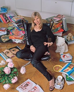 Angelika Taschen photographed in her Berlin Apartment with coffee Table Books