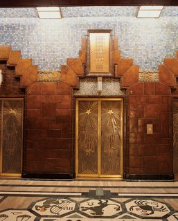 Lavish tile treatment and intricately-etched elevator doors are found inside the Art Deco Marine Building.