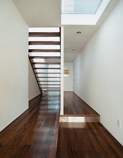 Messiness is not allowed, but creative storage, like drawers that slide into the platform beneath the stair, makes organization easier.
