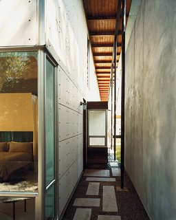A series of stepping stones leads from the private garden room behind the master bedroom into the open yard.